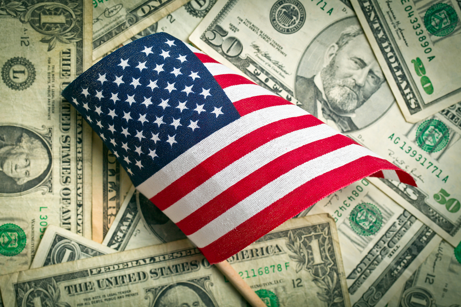top view american flag on us dollars background