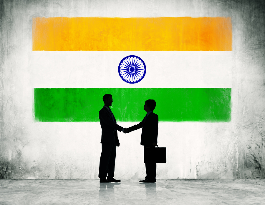 Two Businessmen Shaking Hands With Flag of India