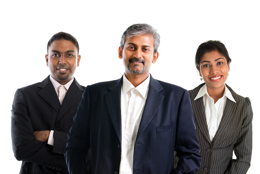 Indian business team.  Asian Indian businessmen and businesswoman in group isolated on white. Teamwork concept. Good looking Indian model.