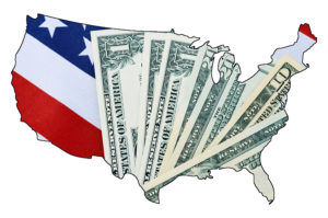 USA Stars and Stripes flag and money within outline of USA map on white background for financial or tax day concept.