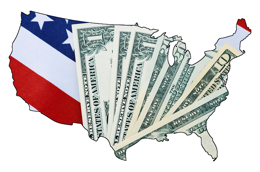 USA Stars and Stripes flag and money within outline of USA map on white background for financial or tax day concept.
