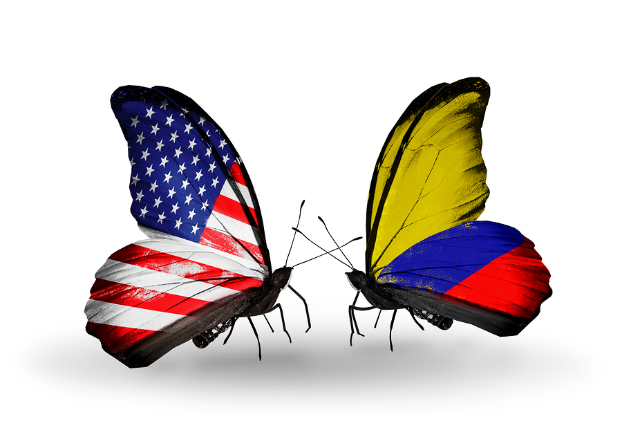 Two butterflies with flags on wings as symbol of relations USA and Columbia