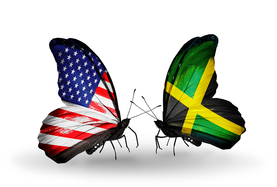 Two butterflies with flags on wings as symbol of relations USA and Jamaica