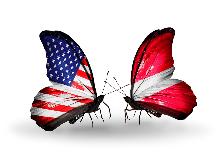Two butterflies with flags on wings as symbol of relations USA and Latvia