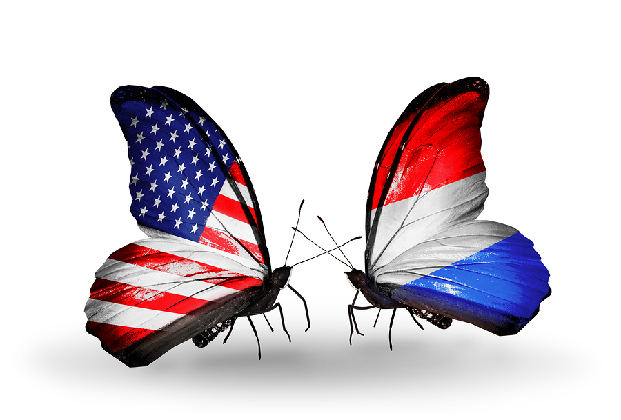 Two butterflies with flags on wings as symbol of relations USA and Luxembourg