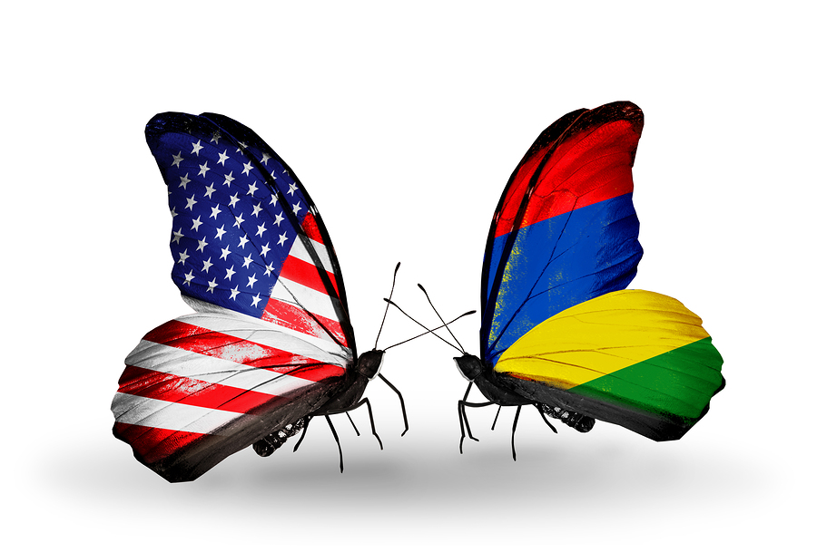 Two butterflies with flags on wings as symbol of relations USA and Mauritius