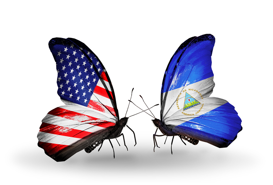 Two butterflies with flags on wings as symbol of relations USA and Nicaragua