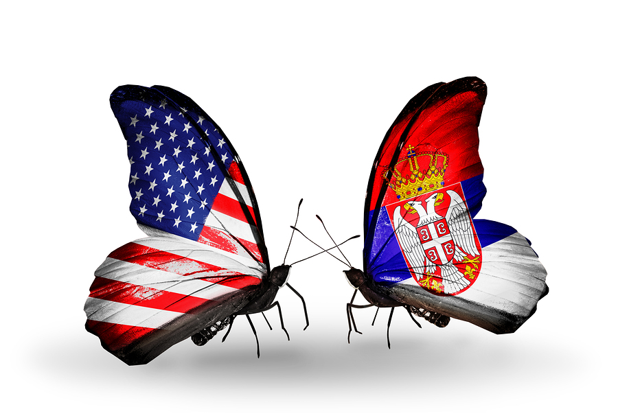 Two butterflies with flags on wings as symbol of relations USA and Serbia