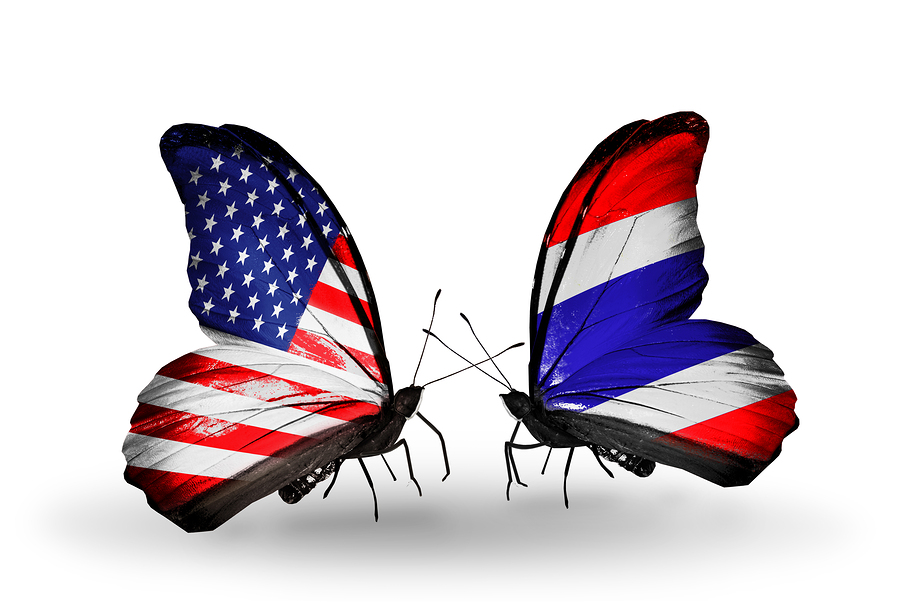 Two butterflies with flags on wings as symbol of relations USA and Thailand