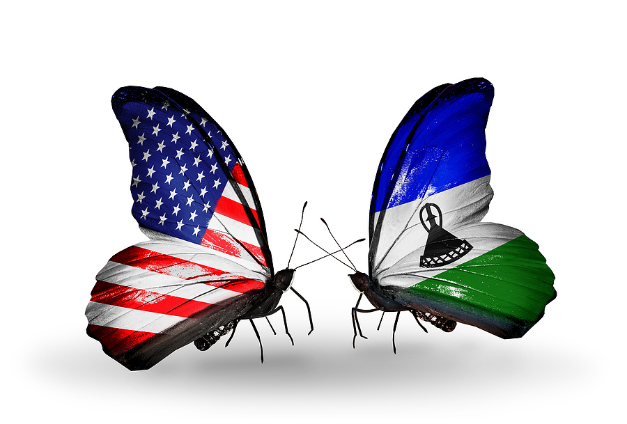 Two butterflies with flags on wings as symbol of relations USA and Lesotho