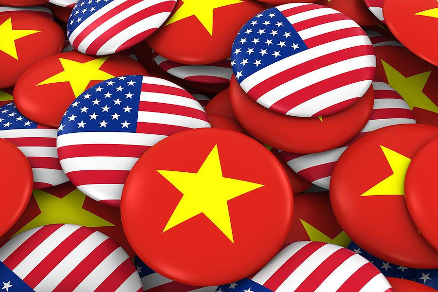USA and Vietnam Badges Background - Pile of American and Vietnamese Flag Buttons 3D Illustration